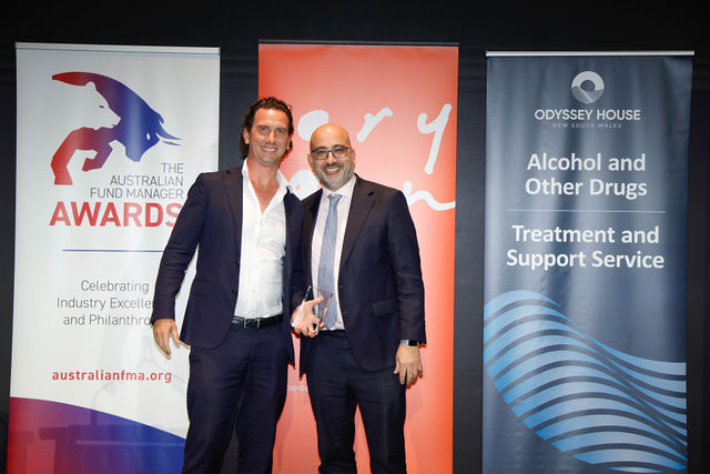 Spheria's Adam Lund accepting the award for best mid cap fund